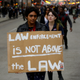 Demonstrators protest as they celebrate the verdict in the murder trial of Chicago police officer Jason Van Dyke along Michigan Avenue on Oct. 5, 2018, in Chicago.
